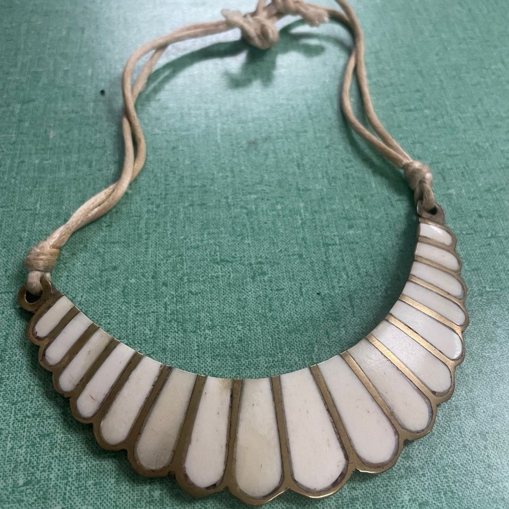 ivory/ gold metal necklace